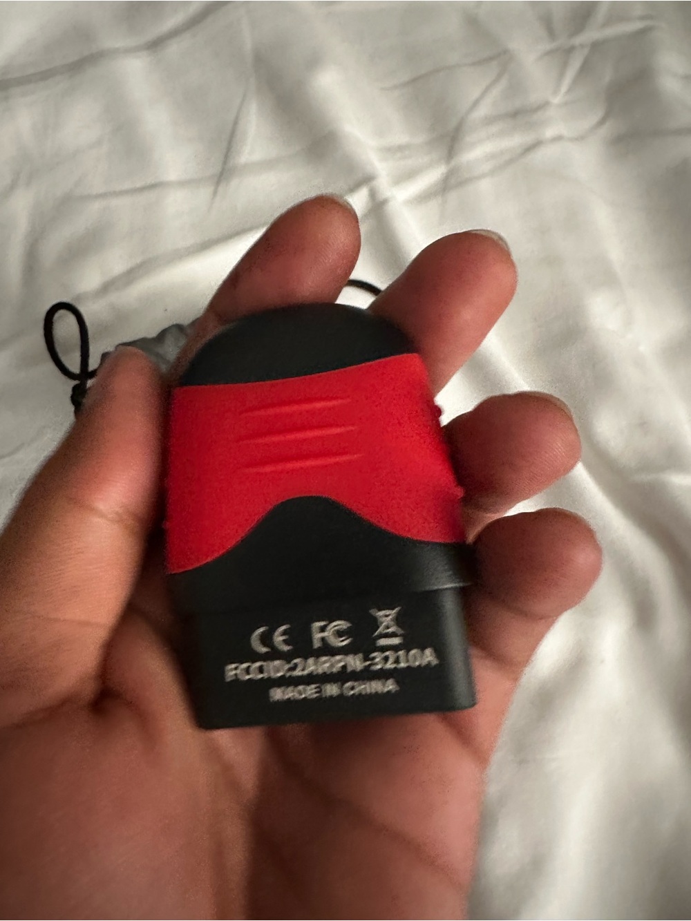 Compact Black & Red Electronic Device